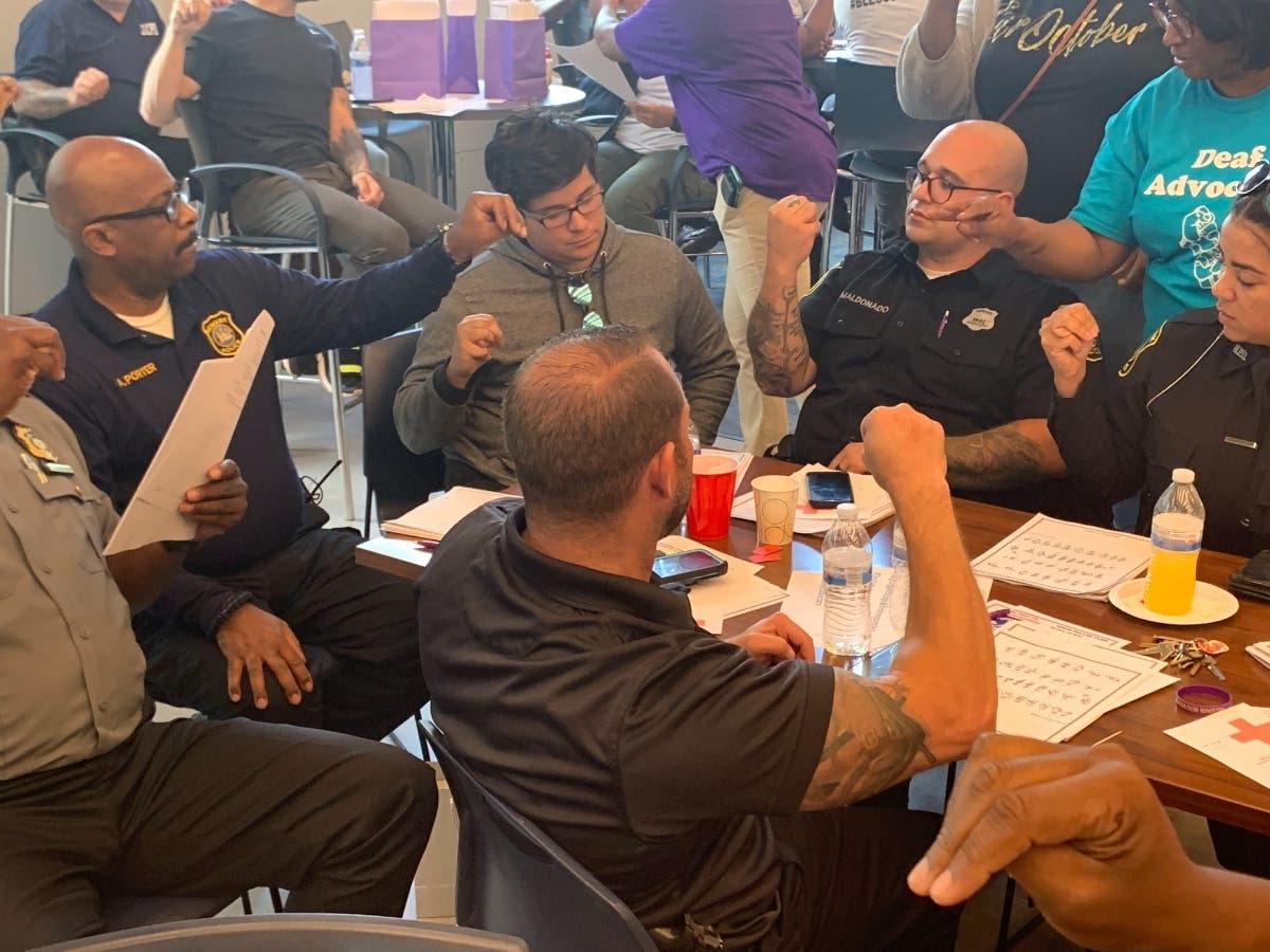 The Newark Public Library’s popular American Sign Language classes are going “on tour” this summer. Above, local first responders are among those who took part in a recent ASL class at the library.