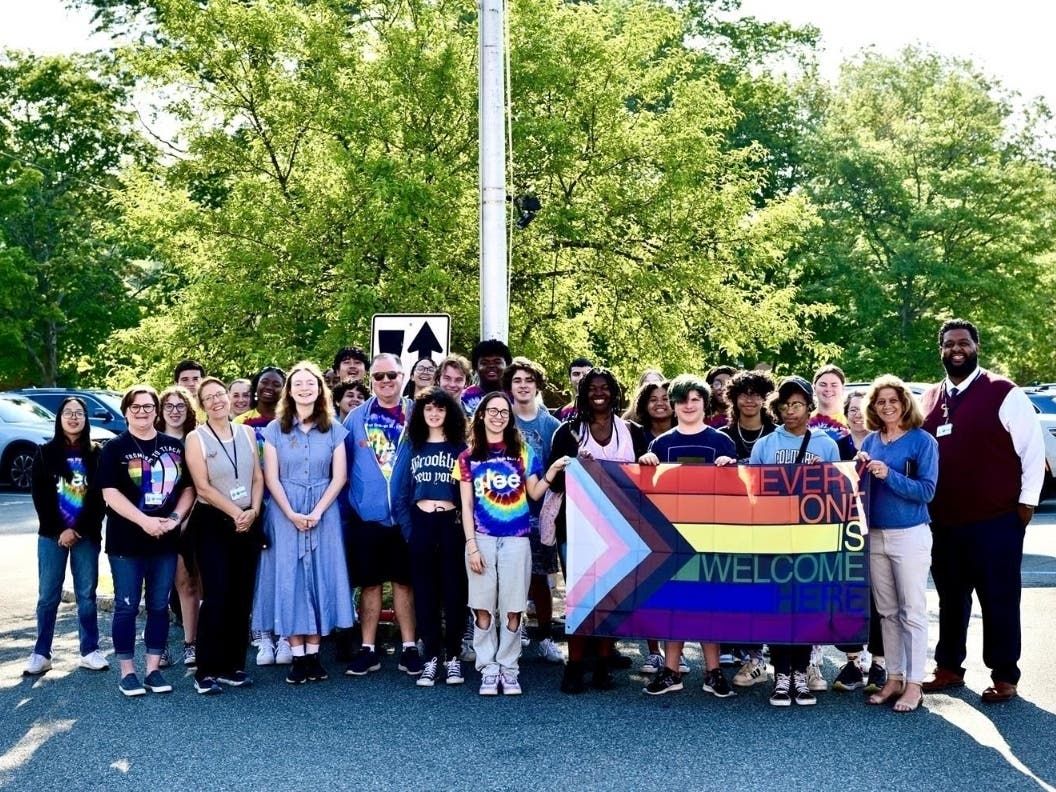 Glee students, GSA, GSA Advisors Jenn Dahl and Deb Coen (second from left and to left of Mayor McCartney), Wendy Mapes and John Hellyer (third and fifth from left), Mayor Susan McCartney and Principal Oscar Guerrero (right).