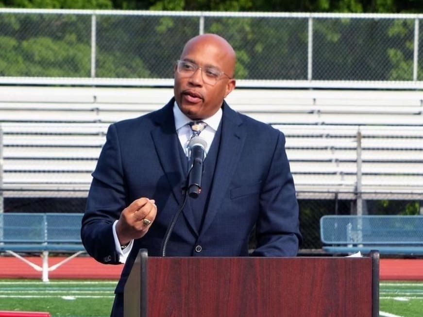 Liberty Middle School principal Xavier Fitzgerald addresses students at graduation in June.