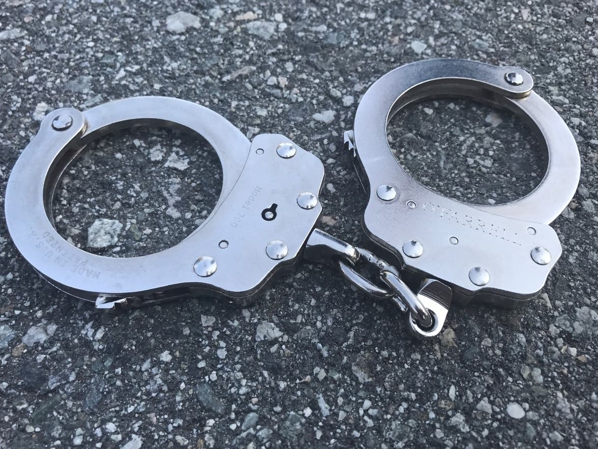Police arrested a man after he tried to enter the Essex County Hall of Records in Newark with a semi-automatic handgun in his book bag on Monday, authorities said.