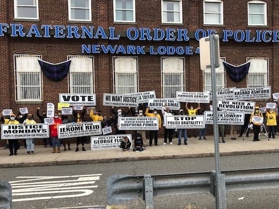 Activists with the People’s Organization for Progress rally outside the Newark Headquarters of the Fraternal Order of Police in 2020.