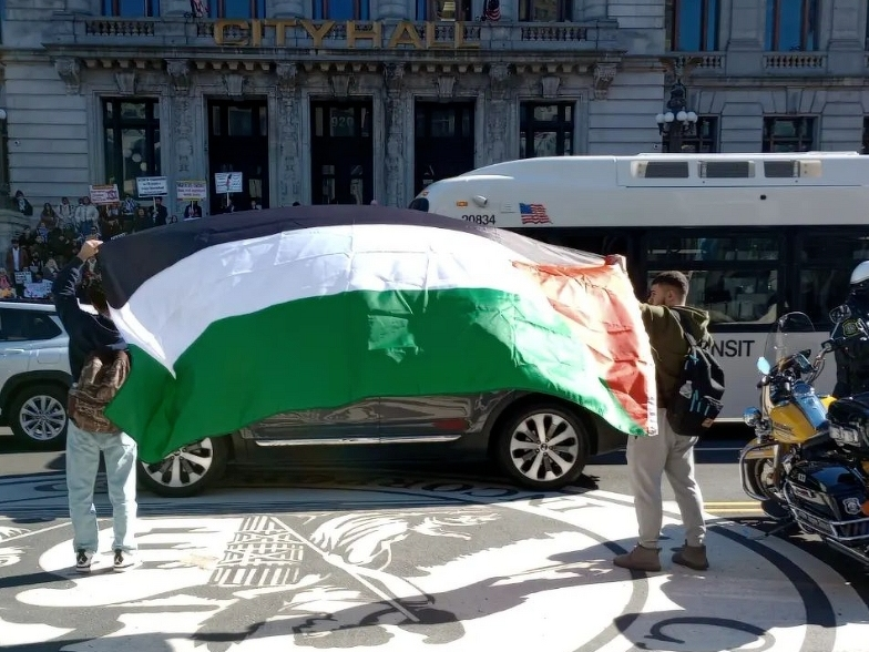 Protesters gather outside Newark City Hall on Wednesday to demand that the city council pass a local resolution in support of a ceasefire.