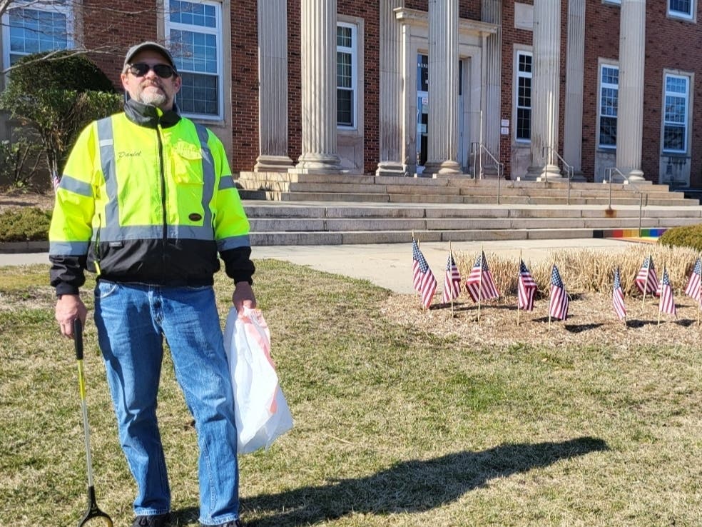Daniel Cunningham works with the Downtown West Orange Alliance to pick up litter in the township.