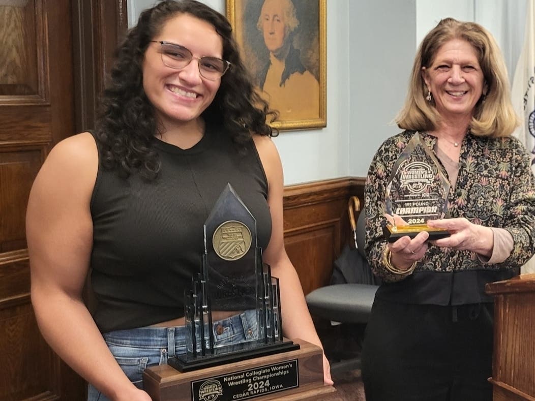 West Orange's mayor and township council took a moment to cheer for former West Orange High School wrestler Sandy Guerrero (left) at the council meeting earlier this week.