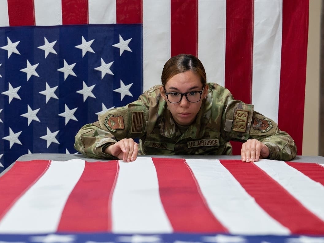 U.S. Rep. Mikie Sherrill (NJ-11) was among the lawmakers who voted no on the NDAA on Friday. Above, Air Force Senior Airman Jocelyn Rosado straightens the stripes on a U.S. flag during the ironing process at Dover Air Force Base, Del., May 21, 2024.