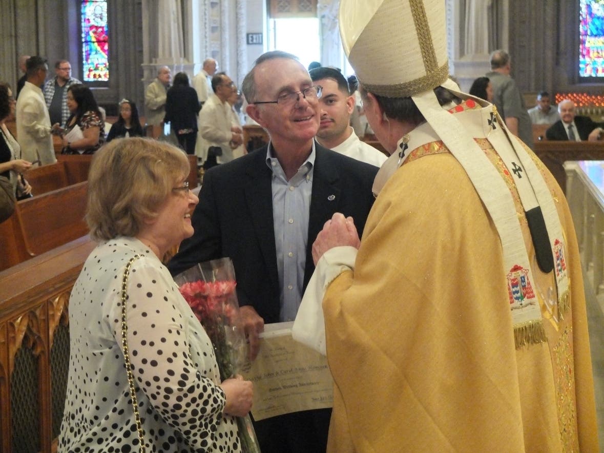 Carol and David Hancock, a NJ couple celebrating their 50th wedding anniversary, receive gold pins from Cardinal Joseph Tobin following the Archdiocese of Newark’s annual Golden Anniversary Mass in the Cathedral Basilica of the Sacred Heart.