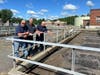 Michael Covello, Assistant Superintendent Kevin Lynn, and James Cooney inspect and plan maintenance on a tank at the WPCF in Livingston, New Jersey.