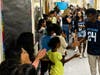High school students from West Orange were recently bused to the elementary schools they attended to be cheered on as they walked through the halls one last time.