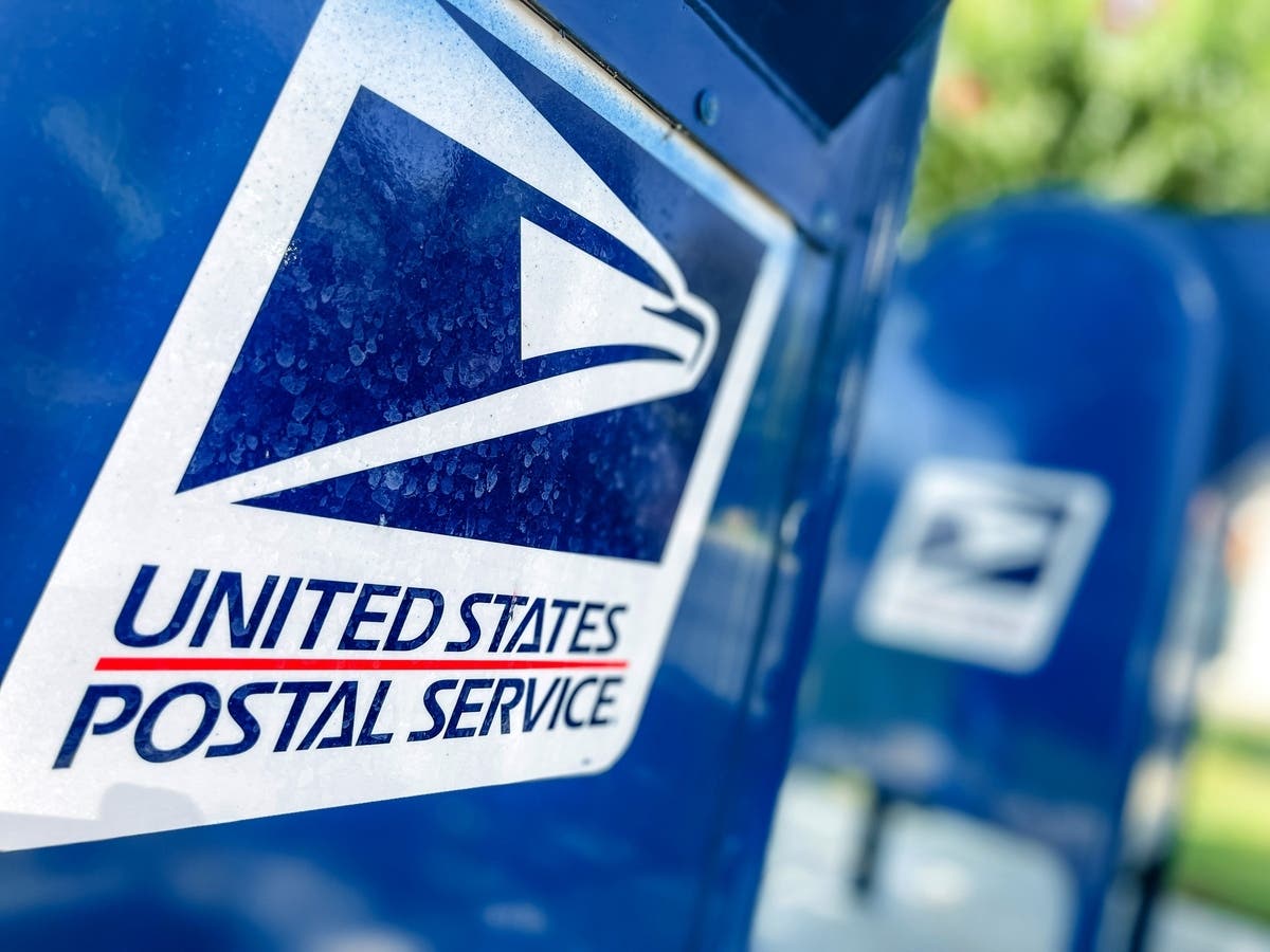 Four Essex County men have been accused of robbing a U.S. Postal Service worker at gunpoint in Newark, authorities announced Wednesday.