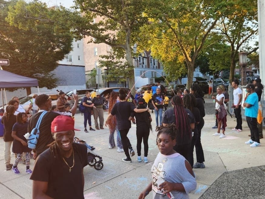 A display of “healing and growing” unites neighbors at Clinton Hill Community Action’s “H.U.G. the Block” event in Essex County, New Jersey.