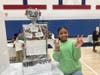 Dozens of students at KIPP SPARK Academy presented their own innovations, inventions or research on a historical Black innovator at a school science fair.