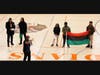 History and Africana Studies Teacher Bashir Muhammad Ptah Akinyele leads the Black History Month opening ceremony at Weequahic High School