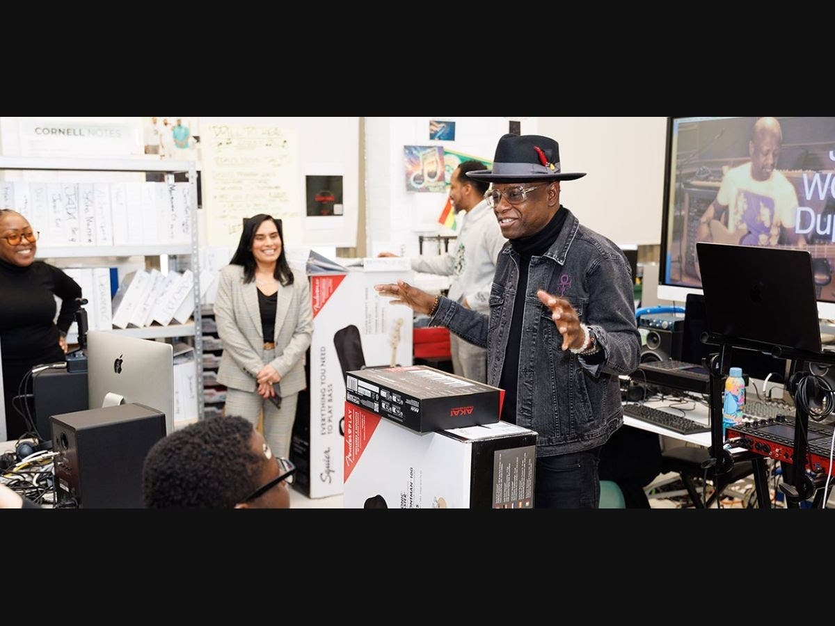 Jerry “Wonda” Duplessis speaks with West Side High School Digital Music Technology students after delivering a variety of donated musical instruments.