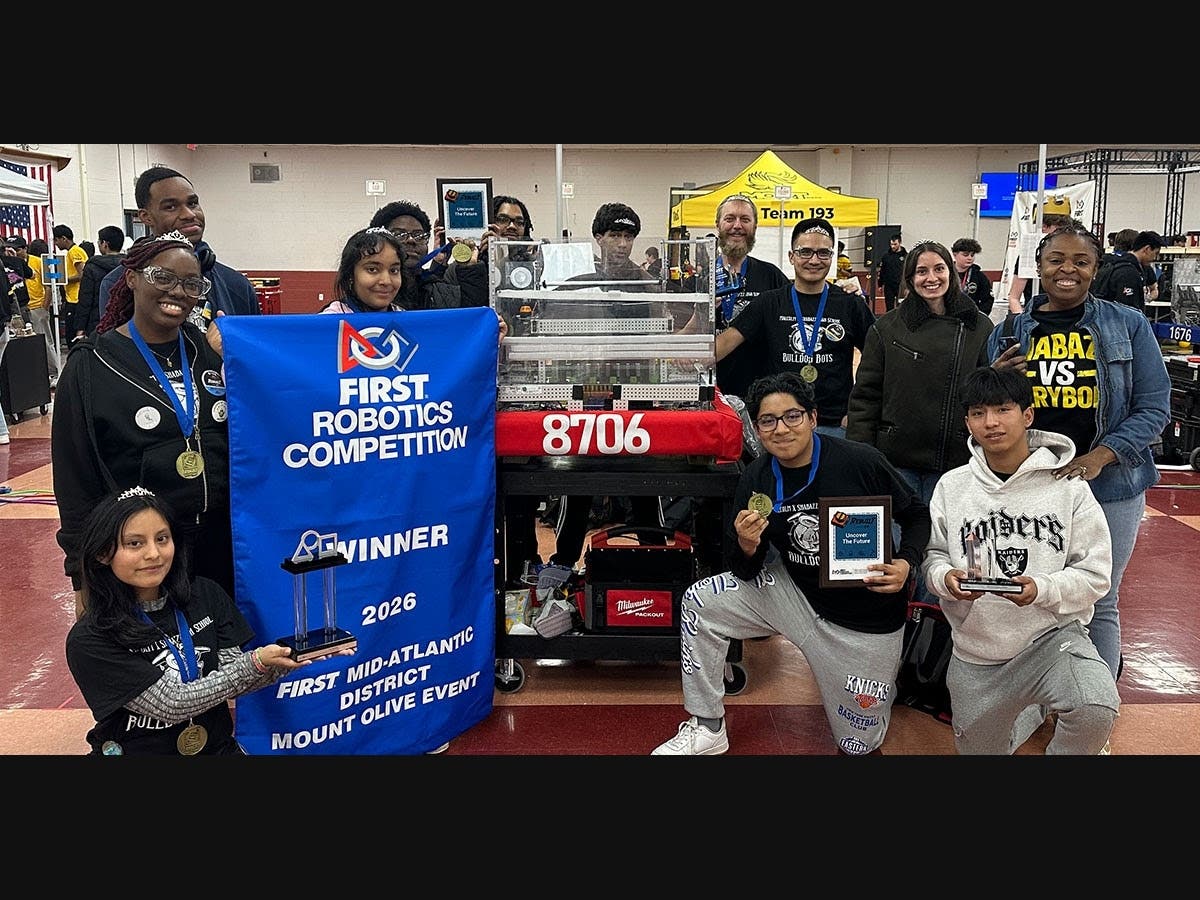 The members of the Malcolm X Shabazz High School Robotics Team after winning their first regional championship
