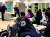 Two captains from the West Orange Fire Department meet with local students at West Orange High School.