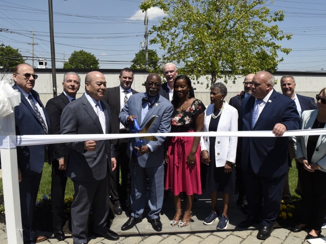A ribbon cutting ceremony is held to unveil a memorial bench in honor of late PVSC member and Newark councilwoman Mildred Crump.