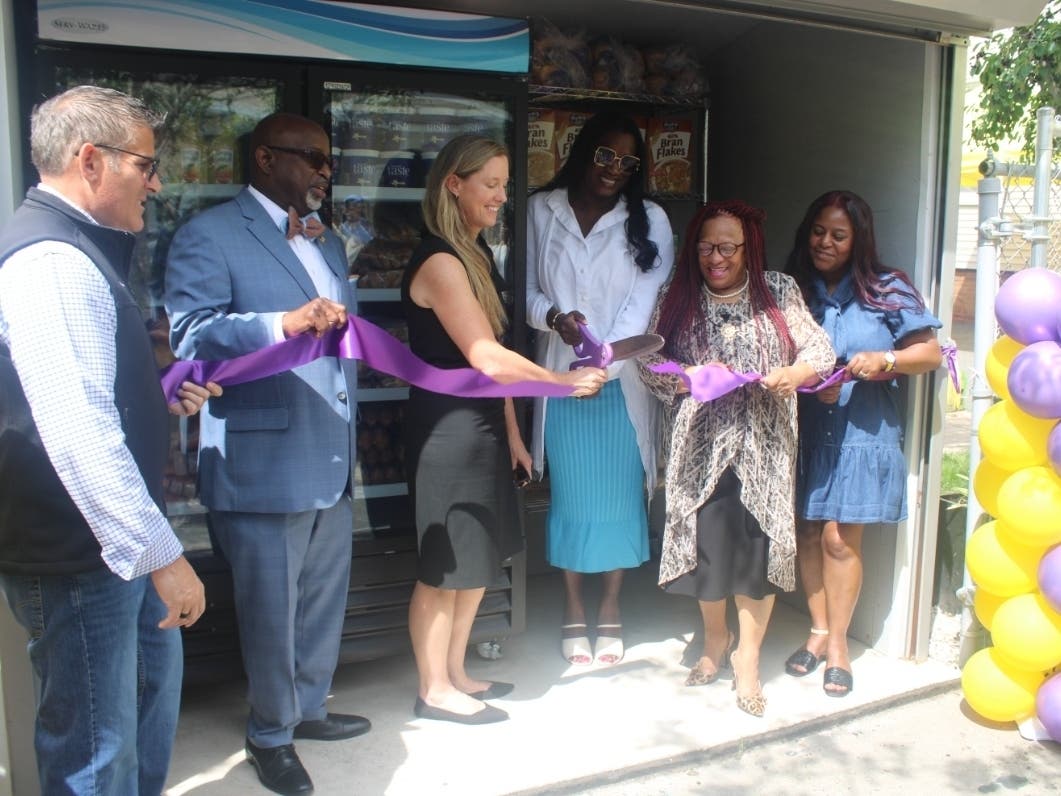 The Ironbound Community Corporation holds a ribbon-cutting ceremony celebrating its Community Refrigerator and Hunger Relief Project, made possible through the support of the Devils Youth Foundation.