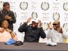 Adekunbi Adetayo after donning the Vanderbilt University hat, symbolizing his choice of where he will play college football after his last season with Malcolm X Shabazz High School in the fall. With him are his mother, Lola Osula, and father, Adetunji Ade