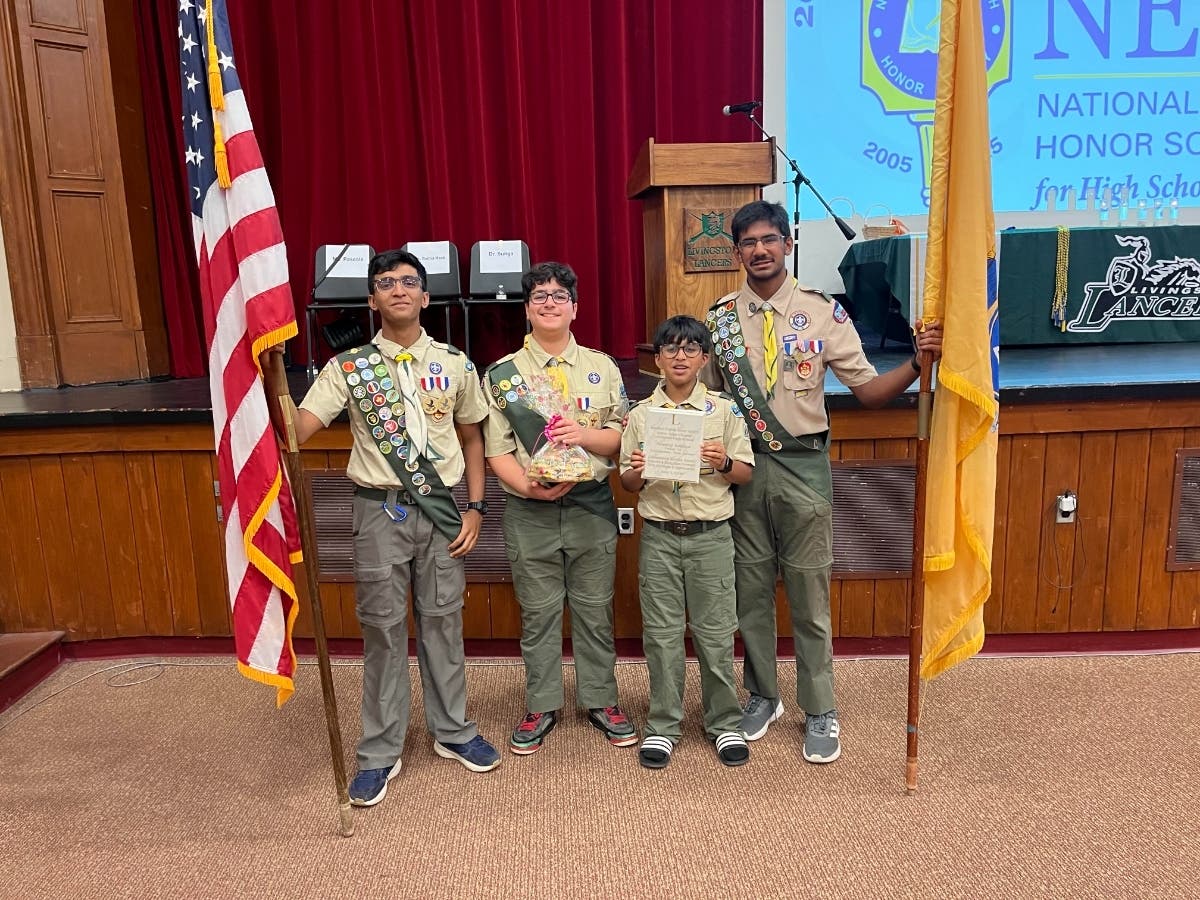 Five members of Boy Scout Troop 12 organized and led the flag ceremony at a National English Honor Society Induction and Recognition Ceremony at Livingston High School.