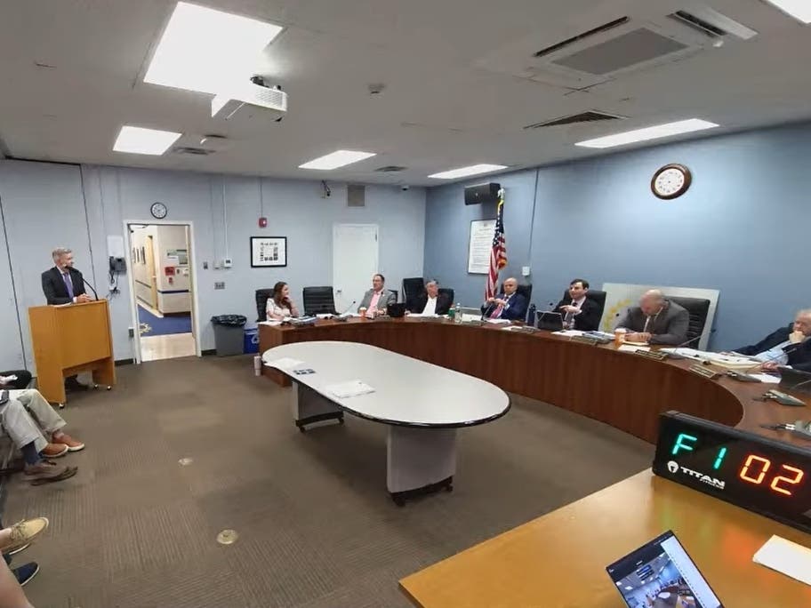 The Millburn Township Committee discusses a real estate settlement agreement involving 9 Main Street at their meeting on July 29, 2026.
