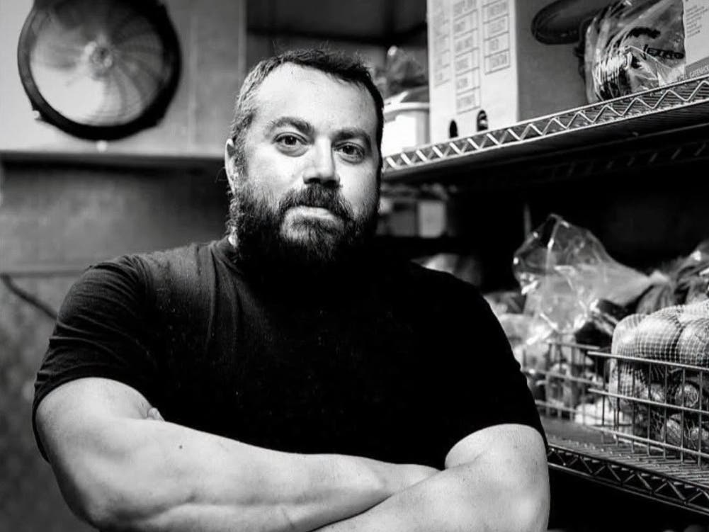 Jarrett Seltzer poses for a photo in the kitchen of Bagels By Jarrett, his restaurant in West Orange, NJ.