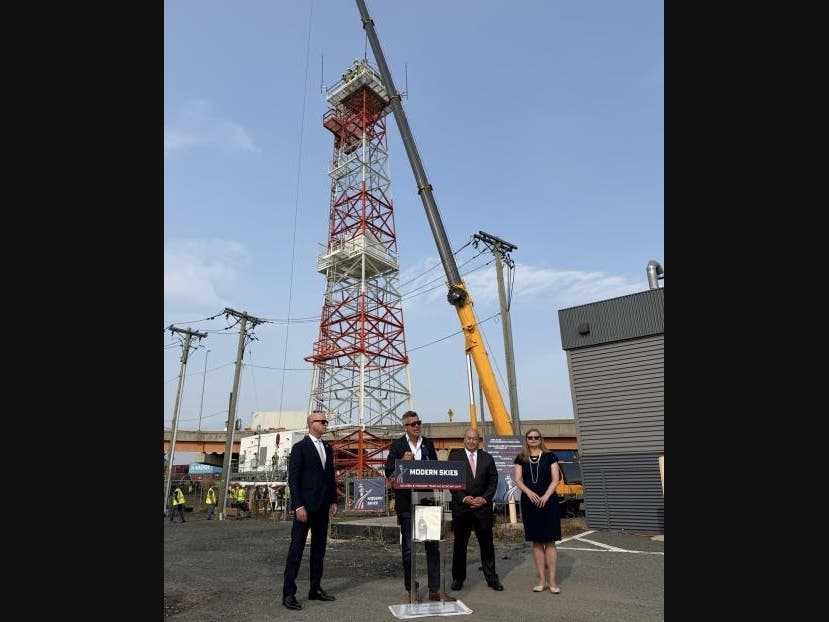 Federal officials gather to announce the installation of a new surface movement radar system at Newark Airport in New Jersey on Aug. 11, 2026.