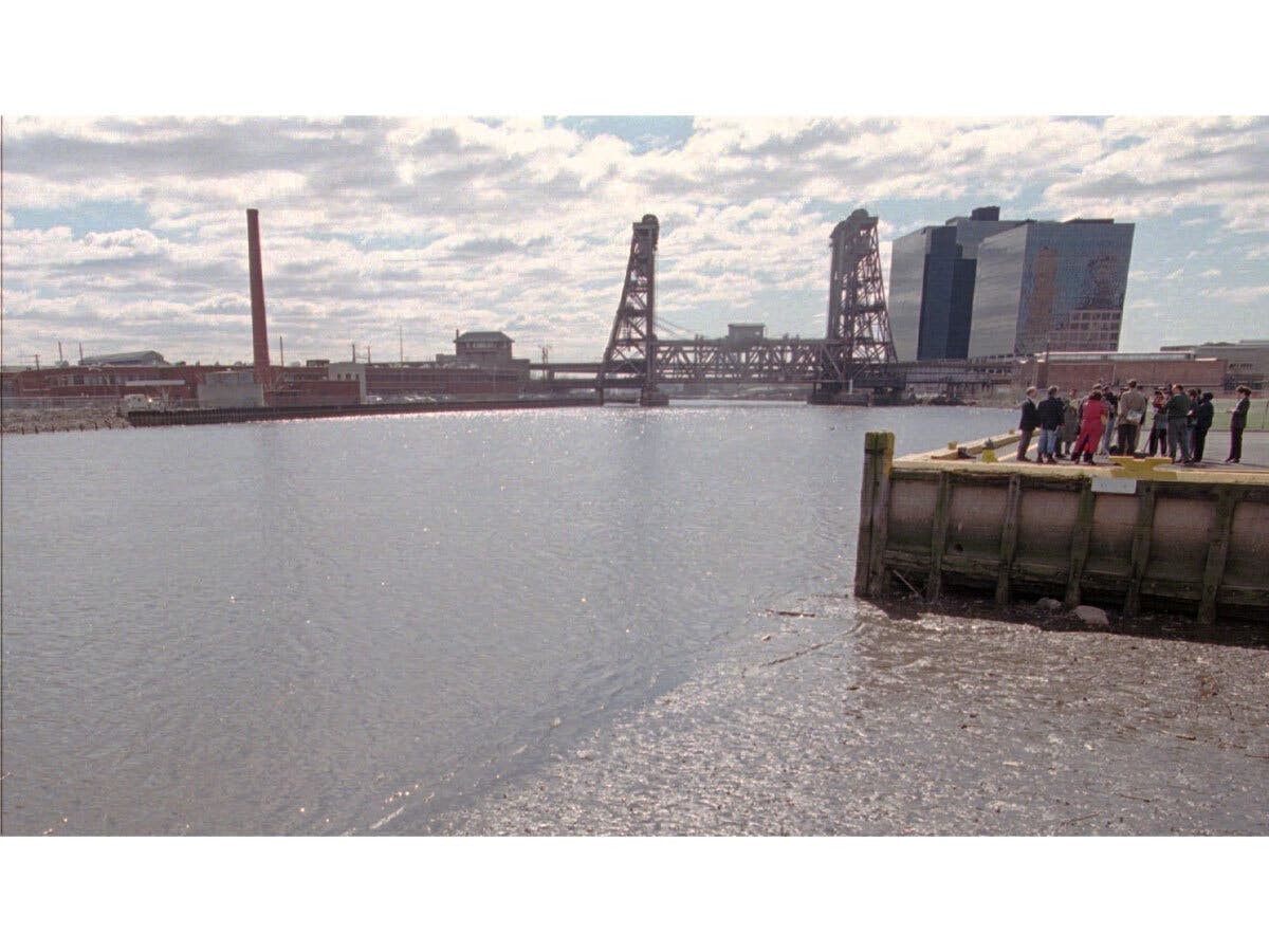 Federal officials have proposed a settlement agreement with Environmental Resource Holdings LLC regarding the Diamond Alkali Superfund site. Above, environmentalists stand on a pier next to the Passaic River in Newark, N.J. on April 6, 1998.