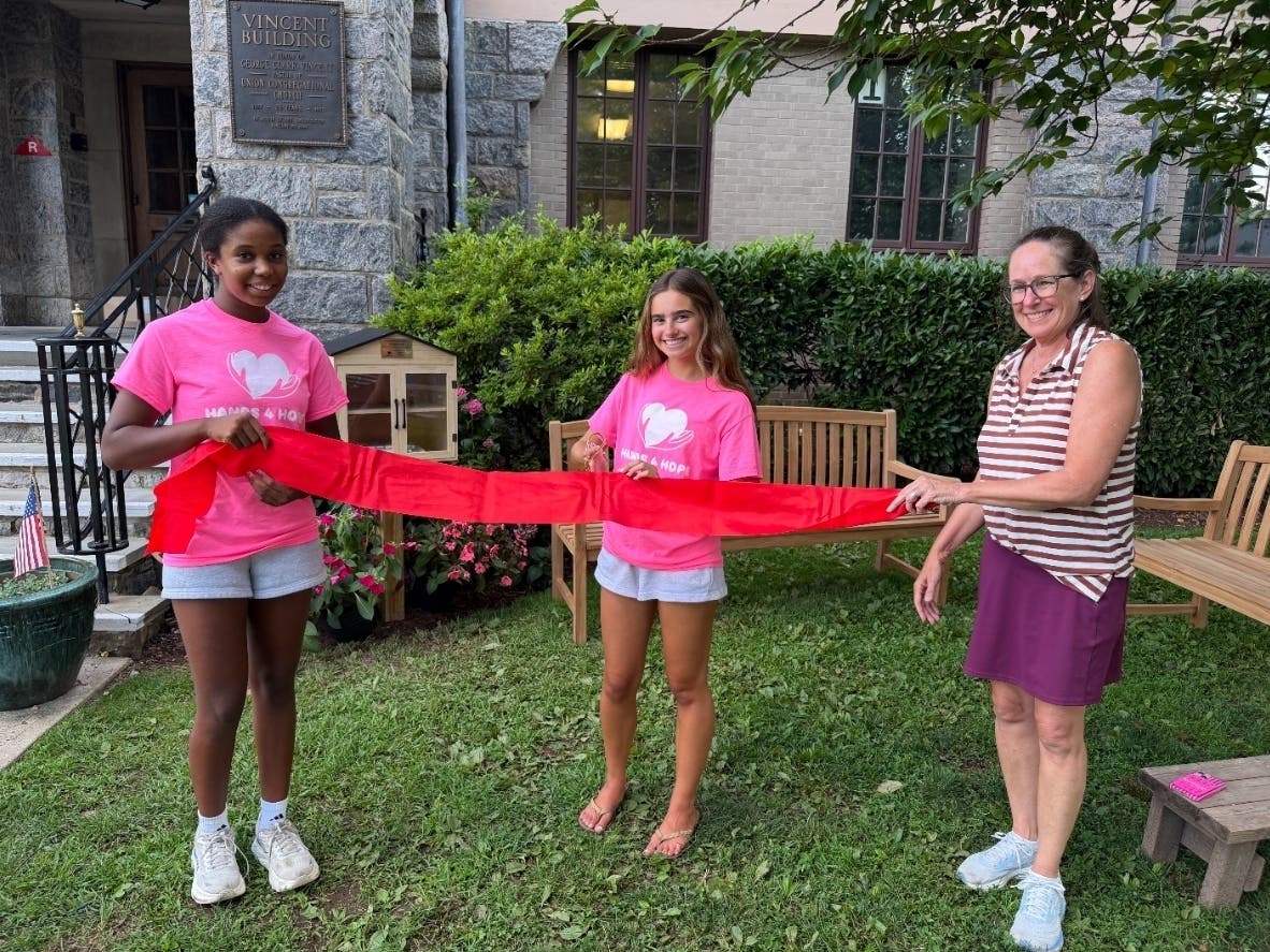 A ribbon-cutting ceremony takes place at the Cooper School in Montclair, NJ to celebrate the opening of a new reading garden.