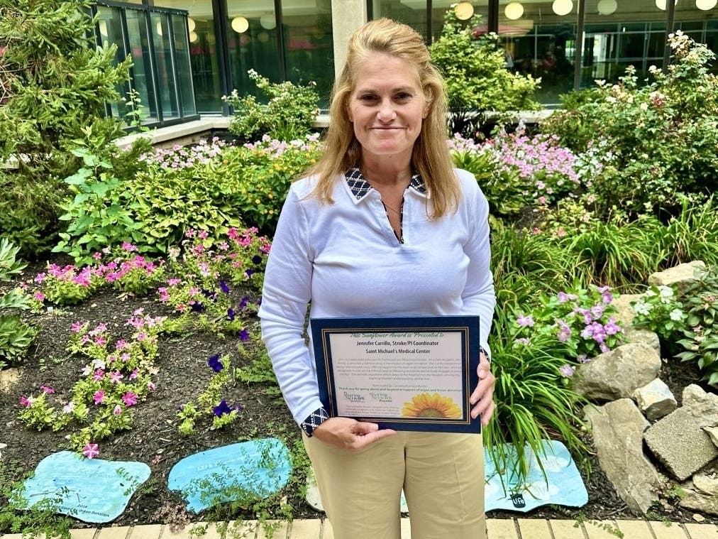 Jennifer Carrillo receives a Sunflower Award, which recognizes health care professionals who "go above and beyond in their roles to provide exceptional care."