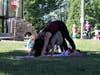 An Ossining mom and her daughter do the downward-facing dog pose during a yoga session.