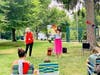 Park School Principal Cynthia Bardwell and Assistant Principal Melissa Stoller read to families in Nelson Park.