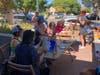 Artist Gina Gabriell talks participants through the painting process at 'Paint on the Patio'