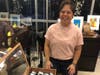 Aura Velarde displaying jewelry for a local artist Chris Tafoya who could not be present