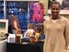 Artist Andrea McCoy Harvey from Oakland with her paintings
