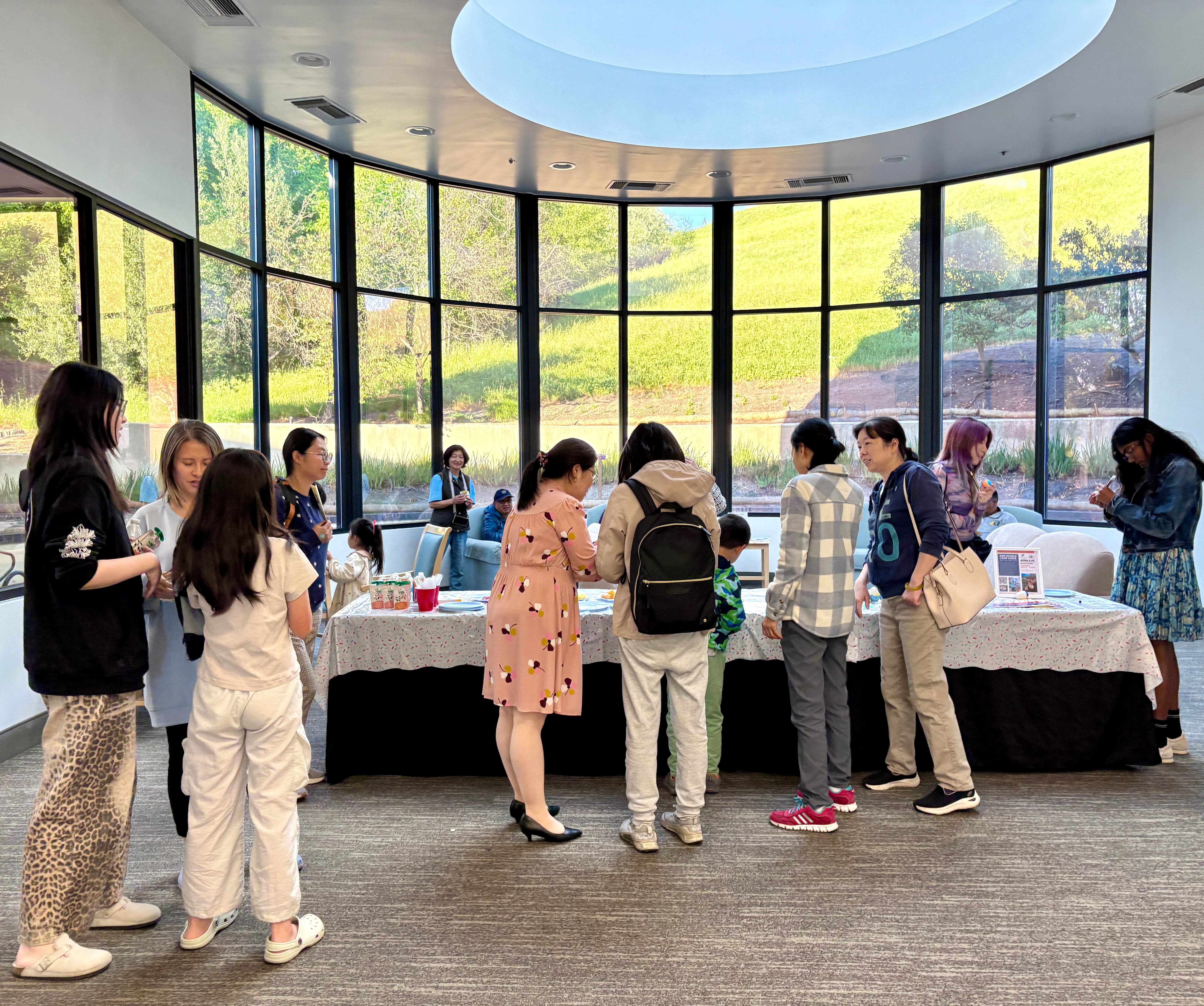 A gathering of artists and guests at the opening reception for the Happy Valley Youth Group show