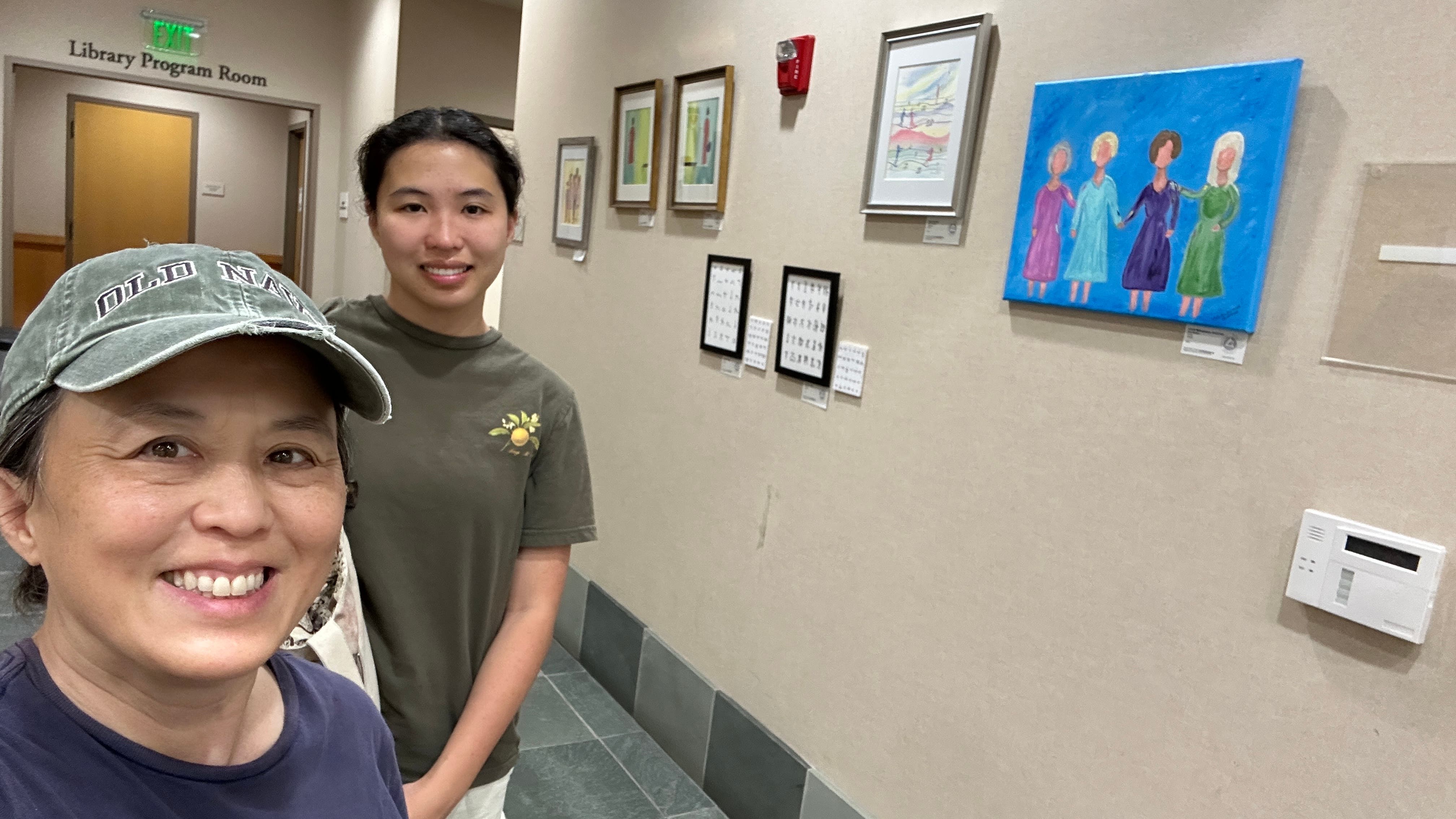 Mom and daughter and art display