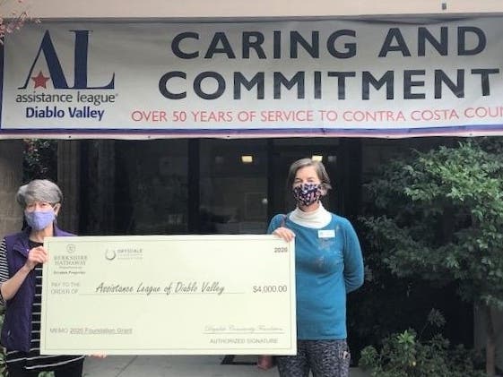 Assistance League of Diablo Valley member volunteer Jackie Griffin (l) and Grants Committee member Ann Livingston (r), accept check from Drysdale Community Foundation to fund weekend meals for elementary schoolchildren.