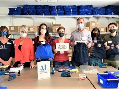 Assistance League of Diablo Valley Corporate Partners Chairman Linda Mercer ( l.) and Operation School Bell Clothing Chairman Susan Angle greet Fehr & Peers employee volunteers (Leader) Kelsey Kiley, Sarah Kistler, Ryan McClain, Grace Chen and Cody Lin.