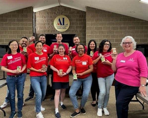 Assistance League President Veronica Gant (far r) thanks Community Volunteers from Wells Fargo, Concord and Oakland, for their indefatigable, “hands on” support.