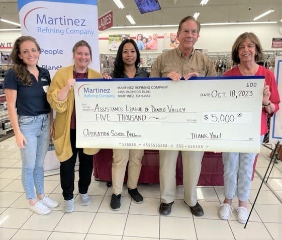 Martinez Refinery Community Partners (l to r) Michele Corey, Kara McDonnell, Jonee Bronswick and Brian Nippa present check to Assistance League Diablo Valley Community Partners Coordinator Linda Mercer at a recent Operation School Bell Shopping Event.