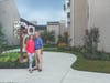 Rick and Jane Baker, son and daughter-in-aw of Kitty Baker, stand in front of the Dream Garden.