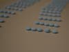 The blue pills above, sold as oxycodone, are actually lethal doses of fentanyl, authorities warn.