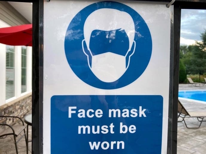 The state remains in the "red zone," according to a White House Task Force report, though numbers are trending downward.