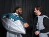 Brandon Graham greets Mike Howanski in front of the Duct Tape Lombardi after the Super Bowl win. 