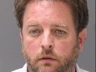 David Lyons has been charged with invasion of privacy and related counts after recording women and children changing in the bathroom, police said.