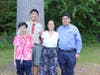Joachim Gatmaitan poses with his family at the outdoor learning space he designed for Tootin' Hills Elementary School