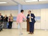 Interim Principal Steve Patrina has the pleasure of awarding certificates as students' families look on