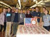 Some of the faculty and students with the 300+ custom wooden pens manufactured during the pen-a-thon