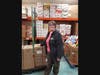 Enfield Food Shelf Executive Director Kathleen Souvigney accepted macaroni and cheese and oatmeal food packets that were assembled by Enfield and other area Rotary Clubs as part of a Day of Service. 