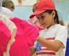 A Back to School Shop participant looks for the perfect shirt in the 2019 pop up store.